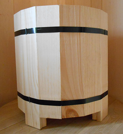 Sleek, well-crafted wooden display barrel made by Dufeck Wood Products.