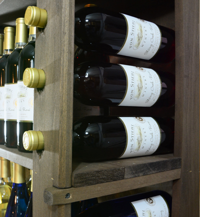 Wine being displayed in custom countertop wood displays by Dufeck Wood Products.