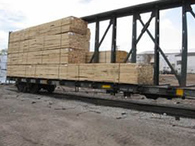 Stacks of lumber arriving to the Rail Car Reload Center